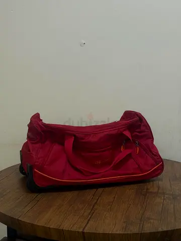 Red wheeled duffel bag - good condition