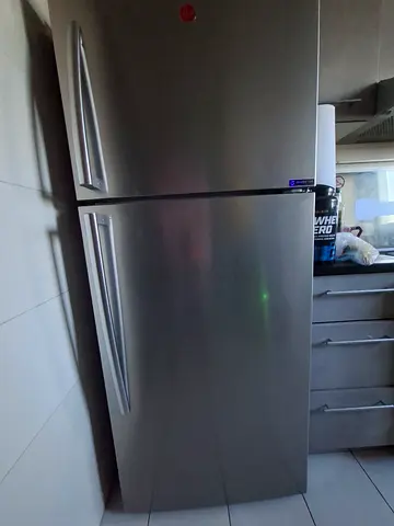Used stainless steel double-door refrigerator (top freezer) - working