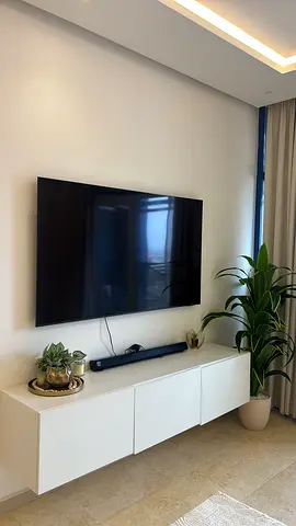 Mounted Flat-Panel TV with Soundbar (Great Condition.I paid 2600 dhs and I have proof payment