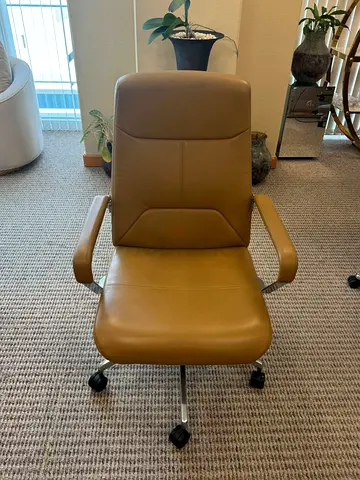 My tan leather swivel office chair - good condition, 9 pcs available per pcs 800 AED