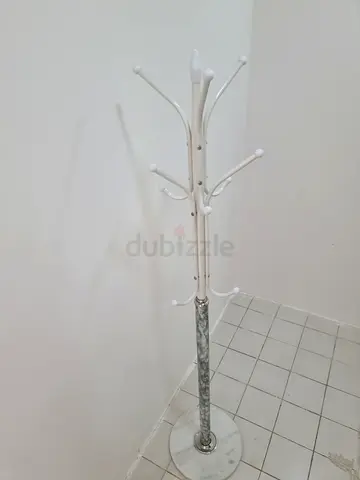 White metal freestanding coat rack with marble base