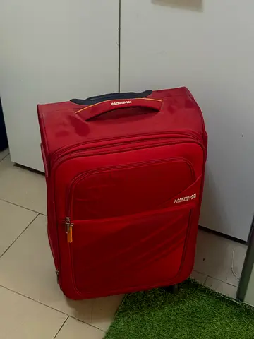 American Tourister Red Rolling Luggage