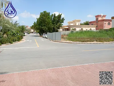 Residential corner plot on two streets in a prime location in Al Rawda 3.