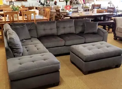 My L-shaped grey sectional sofa with matching ottoman