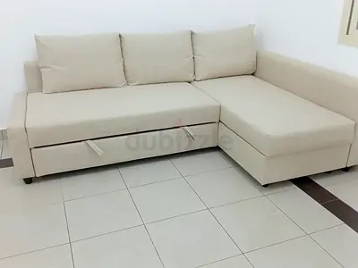 Beige L-shaped Sofa with Under-seat Storage - Good Condition
