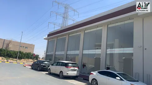 Prime Commercial Building in Al Helio 1 | 2nd Building from Al Zubair Main Road | Corner Unit | All Fees Included!