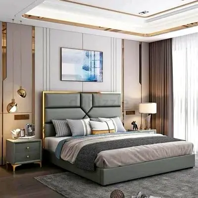Modern grey upholstered King Size bed with padded headboard