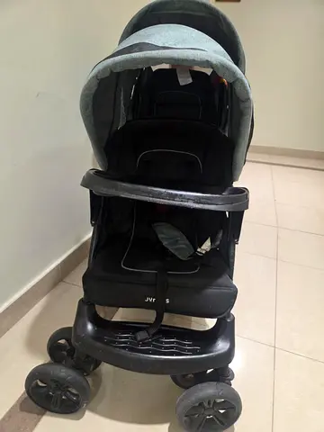 My used single stroller with canopy and snack tray