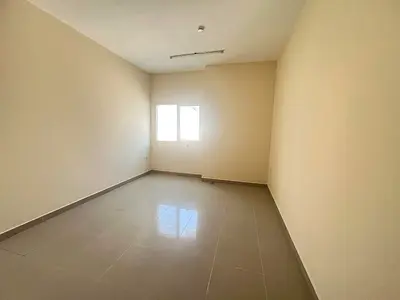 Free parking, two bedrooms and a living room, spacious, for annual rent in Sharjah, Al Butina, close to all services.