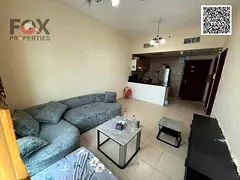 Furnished one-bedroom apartment with living room, balcony, and two bathrooms for annual rent in Ajma