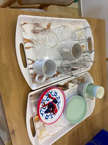 FREE!! Pick up asap!!! Two large marble-effect serving trays with assorted cups, plates and glasses