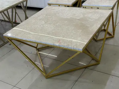 geometric gold coffee table with marble-top