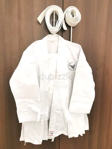 White karate/judo gi with two white belts.