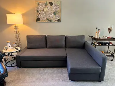My dark grey L-shaped sectional sofa with right-side chaise