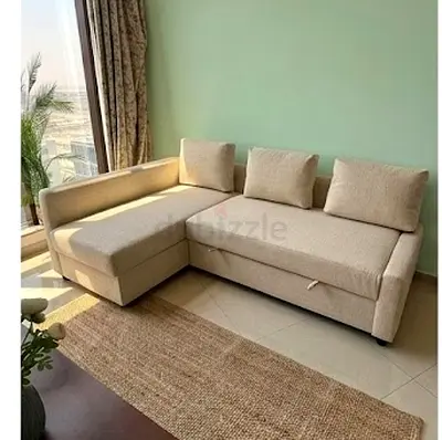 Beige L-shaped sofa with chaise, good condition