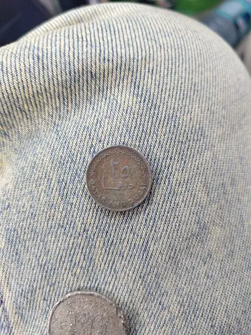 Two vintage coins — collectible lot (one pictured)