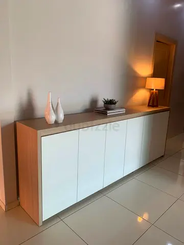 My long wooden sideboard with white doors — spacious storage cabinet