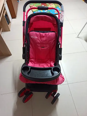 Pink baby stroller with snack tray - lightly used