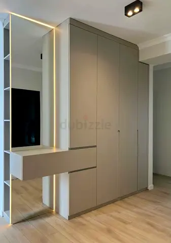 Wardrobes  Cabinets . Temple cupboard • Kitchen Cabinets • Wooden Flooring. • TV media wall Unit.