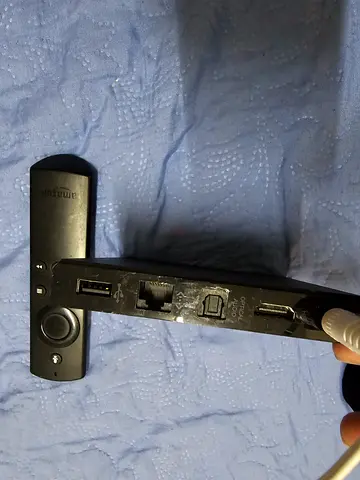 Amazon Fire TV (1st Generation) media streaming box and remote.