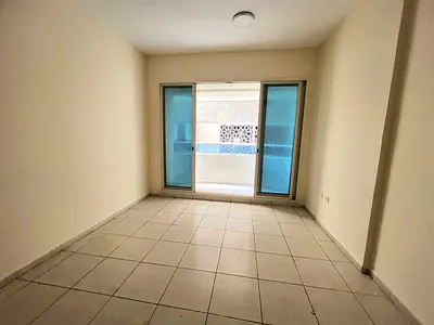 Three-bedroom apartment with a living room in Al Taawun, with gym, swimming pool, parking, air conditioning covered by the landlord, and attestation c