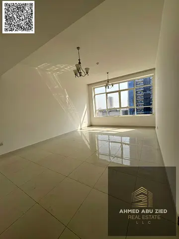 Two master bedrooms and a living room in Al Rashidiya with two balconies and an open view, priced at AED 56,000. Modern and contemporary finishes. Pri