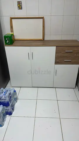 White storage cabinet with wood top and two drawers