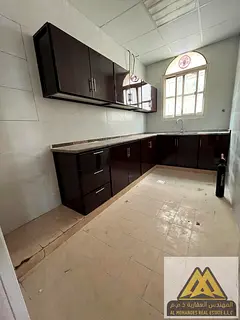 Spacious one-bedroom apartment with two bathrooms and two balconies in a prime location in Al Rashid