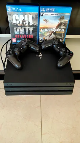 PS4 Pro with 2 DualShock controllers and 2 PS4 games (Call of Duty Vanguard, Ghost Recon)