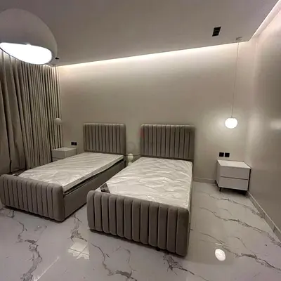 New Set of 2 grey upholstered single beds with mattresses