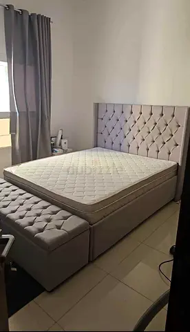 Tufted upholstered bed frame with mattress and storage bench