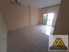 A distinctive two-bedroom apartment with a living room, including a master bedroom fully lit with na