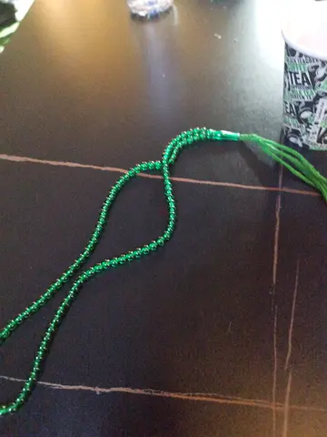 Green beaded tassel necklace