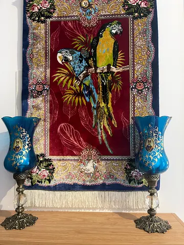 Persian-style decorative wall rug with antiques candlesticks