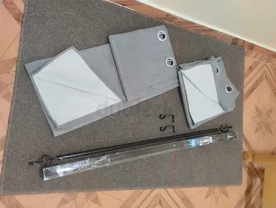 Blackout gray curtains with 2 rods all for AED 50