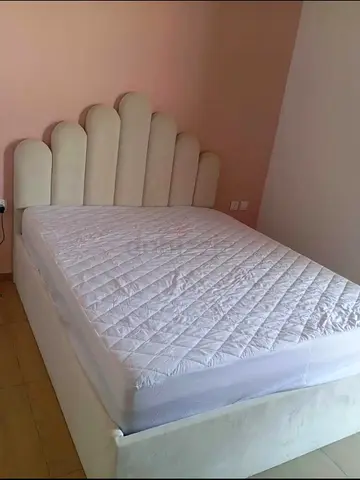 My upholstered bed with scalloped headboard - good condition