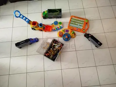 Mixed bundle of kids toys — cars, animal figures and learning toys