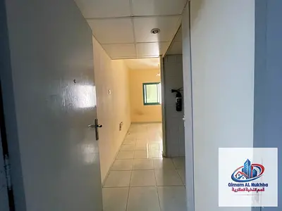 The most beautiful and best-priced one-bedroom apartment with a living room in Sharjah, featuring a balcony, central air conditioning, and central gas