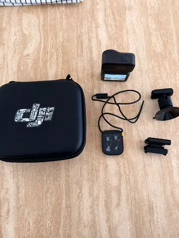 DJI Osmo Nano Action camera with mounts, remote and hard case, in perfect condition barely used.