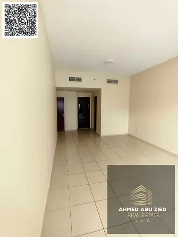 One bedroom and living room in Ajman One Towers, spacious with free parking, priced at AED 36,000.