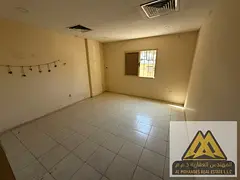 Studio apartment for rent in Al Rashidiya 2, Ajman. Spacious area, semi-separate kitchen, prime loca