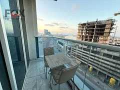 Studio for annual rent in Al Waha Towers in Al Rashidia 1 area, fully furnished, balcony with open v