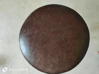 Adjustable brown bar stool with leather seat — some base wear