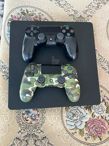 My PS4 Slim with 2 DualShock 4 controllers (black  camo)