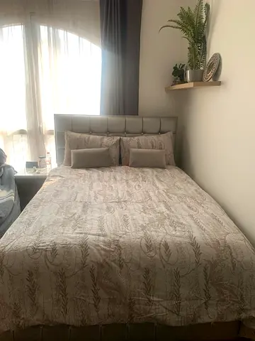 Queen upholstered bed frame with padded headboard . HEADBOARD ONLY NO MATTRESS