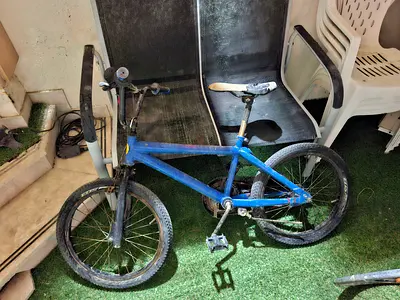 Blue childrens BMX bike - used