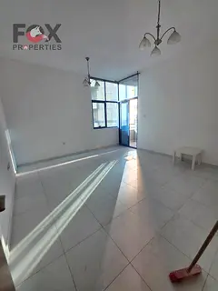 A unique opportunity for annual rent in Al Rashidiya 2 within Falcon Towers, a spacious apartment wi