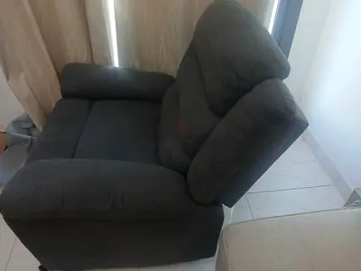 My dark grey cushioned armchair - good condition