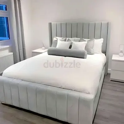 Brand New light grey upholstered bed with channel headboard