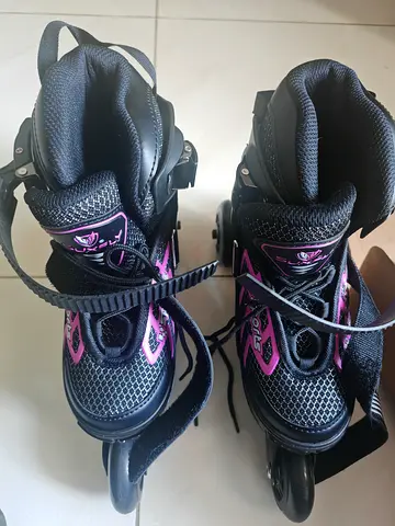 My black  pink inline roller skates, excellent condition